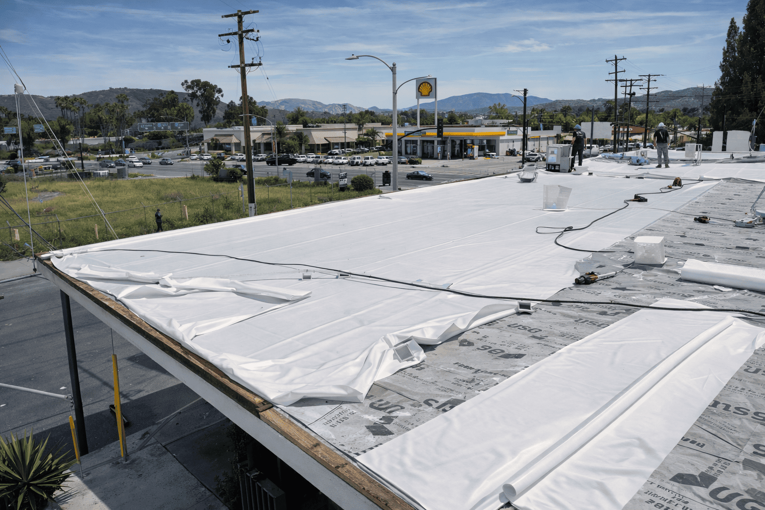 Commercial flat roof membrane installation by Legacy Contractor in Orange County NJ on a retail building.