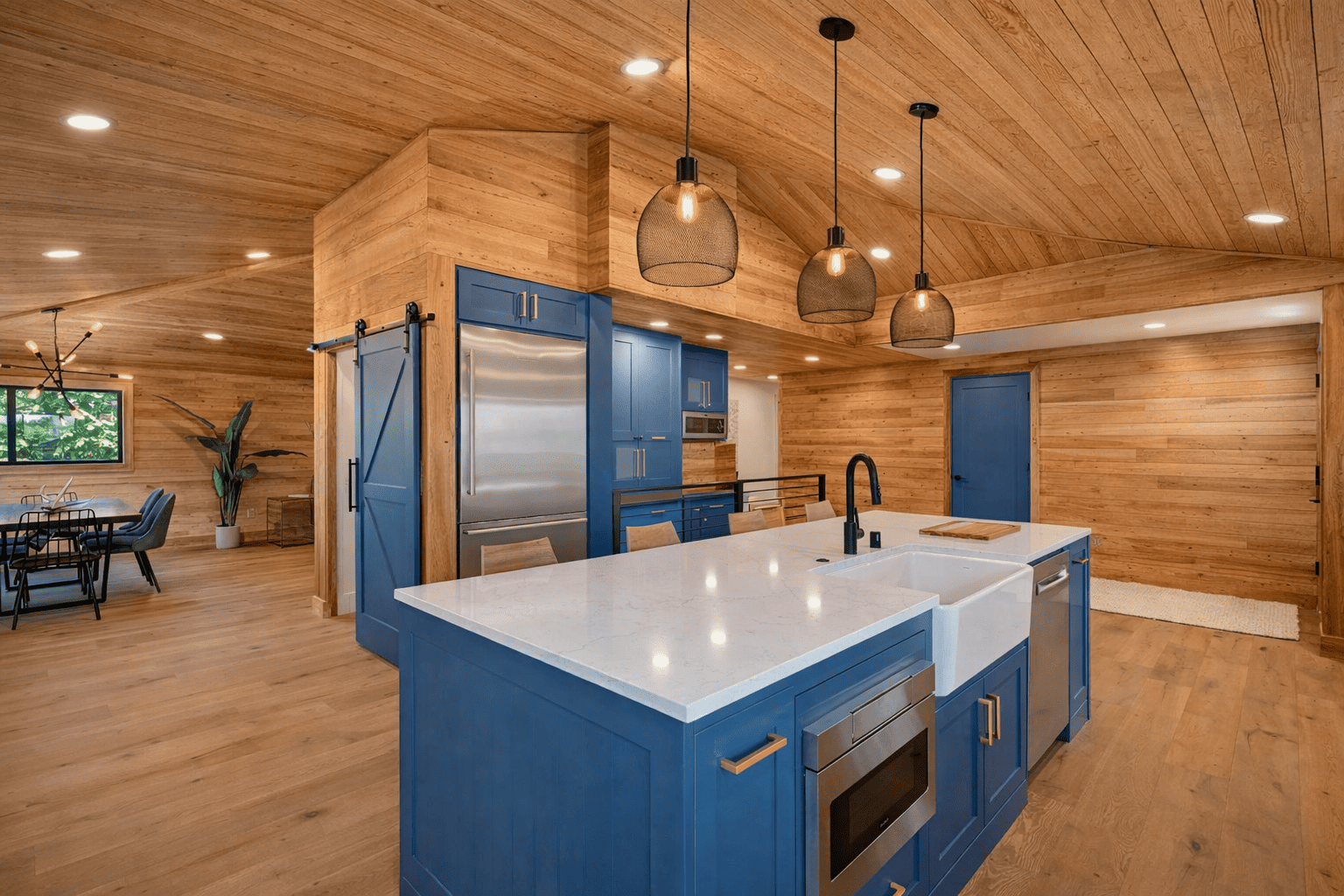 Custom kitchen interior with exposed wood beam ceiling and vaulted roof by Bluebeam Group in Orange County NJ