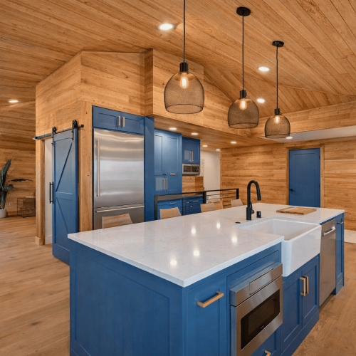 Custom kitchen interior with exposed wood beam ceiling and vaulted roof by Bluebeam Group in Orange County NJ